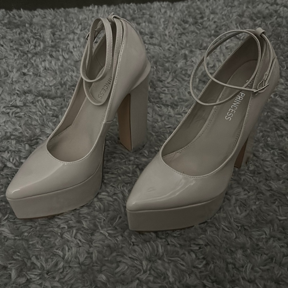 Nude pumps with 5 inch heel. Size 9 Only worn once inside